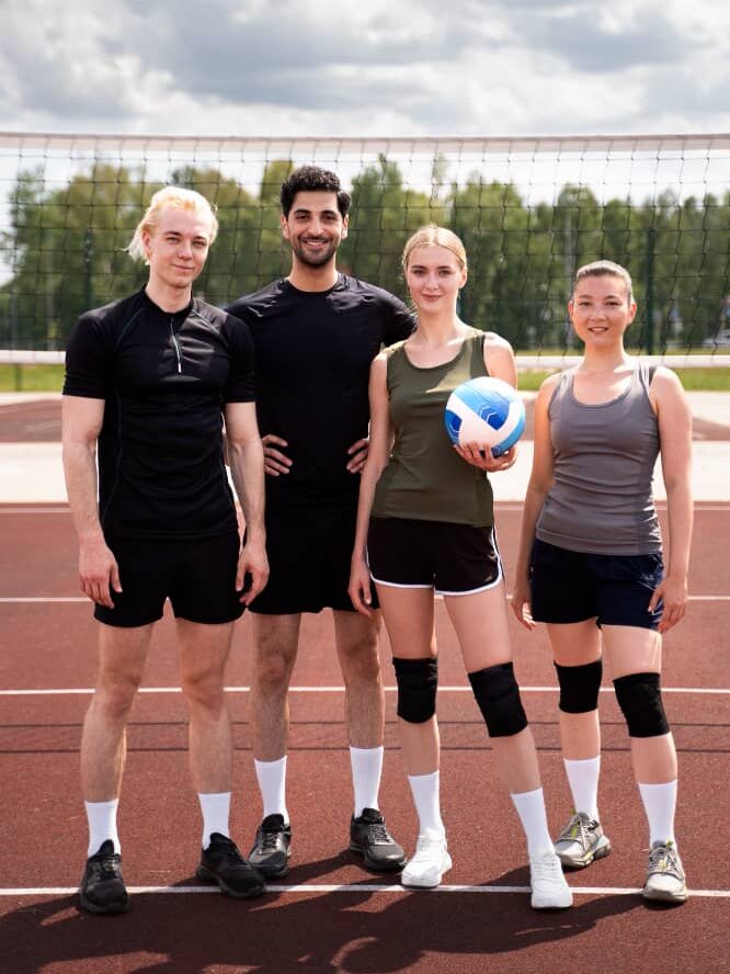 volleyball players having matchcompresssssss e1697643998864