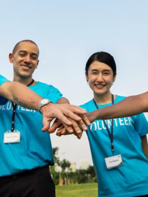 team-volunteers-stacking-hands team-volunteers-stacking-hands
